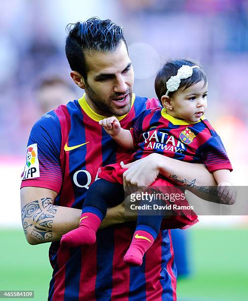 Cesc Fabregas of FC Barcelona holds his daughter Lia during the La Liga match between FC Barcelona and Elche FC at Camp Nou on January 5, 2014 in...