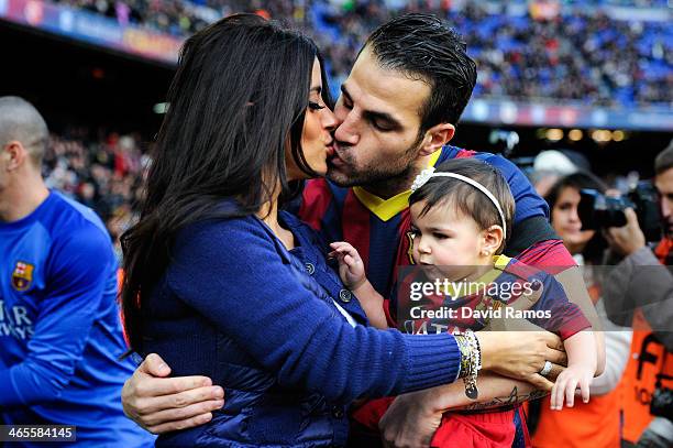 Cesc Fabregas of FC Barcelona kisses his girlfriend Daniella Semaan as he holds his daughter Lia during the La Liga match between FC Barcelona and...