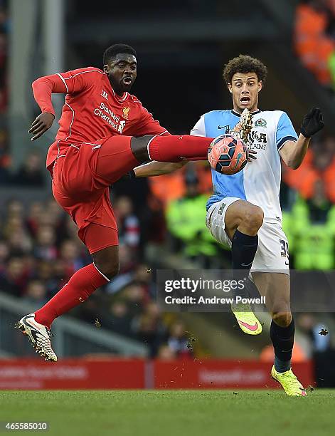 Kolo Toure of Liverpool competes with Rudy Gestede of Blackburn Rovers during the FA Cup Quarter Final match between Liverpool and Blackburn Rovers...