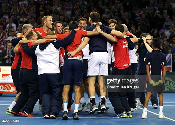 The victorious Aegon GB Davis Cup Team of Andy Murray, James Ward, Jamie Murray and Dominic Inglot celebrate with support staff during Day 3 of the...