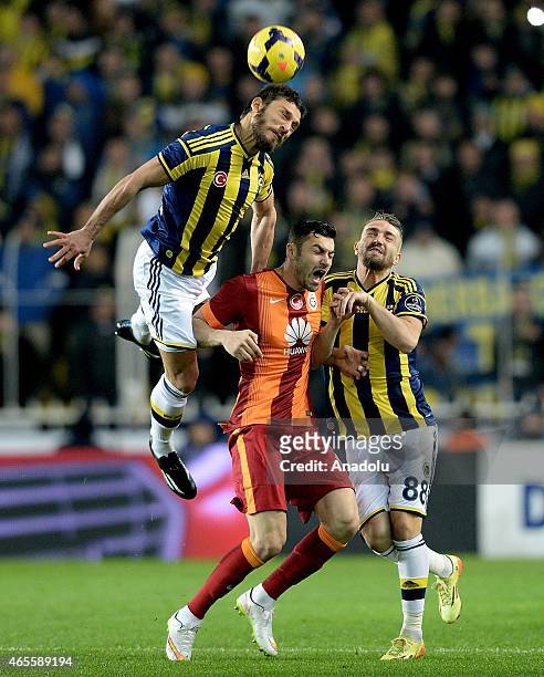 Burak Ylmaz of Galatasaray in action against Caner Erkin and Egemen Korkmaz of Fenerbahce during Turkish Spor Toto League match between Fenerbahce...