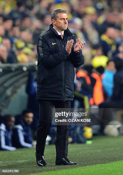 Galatasaray head coach Hamza Hamzaoglu gestures on March 8, 2015 during a Turkish Sport Toto Super League football match Fenerbahce vs. Galatasaray...