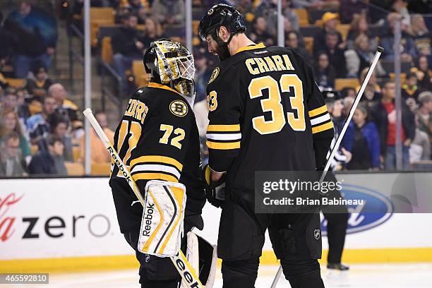 Niklas Svedberg and Zdeno Chara of the Boston Bruins talk during a timeout against the Detroit Red Wings at the TD Garden on March 8, 2015 in Boston,...