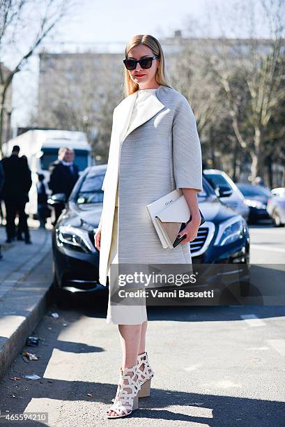 Lisa McComb poses wearing a Celine coat and clutch and Maiyet shoes on Day 6 of Paris Fashion Week Womenswear FW15 on March 8, 2015 in Paris, France.