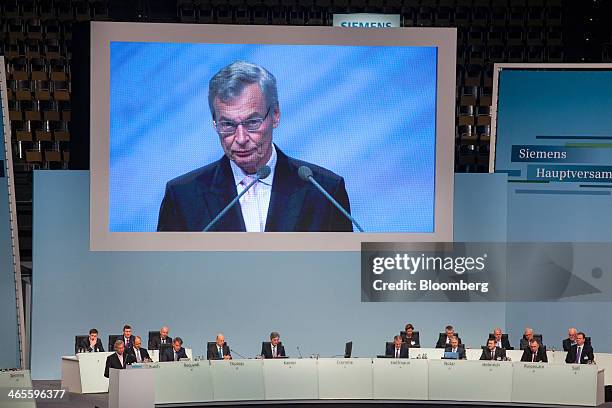 Gerhard Cromme, chairman of Siemens AG, is displayed on a giant screen during a news conference to announce the company's results at Olympia Hall in...