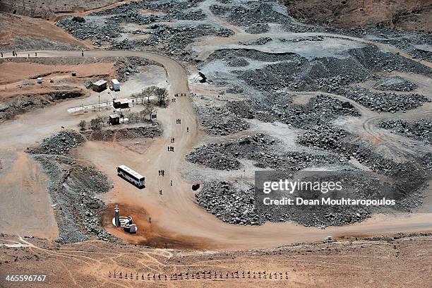 General aerial view as tourists on a bus visit the site famous for the Chilean mining accident in 2010, on January 17, 2014 in Copiapo, Chile. The...
