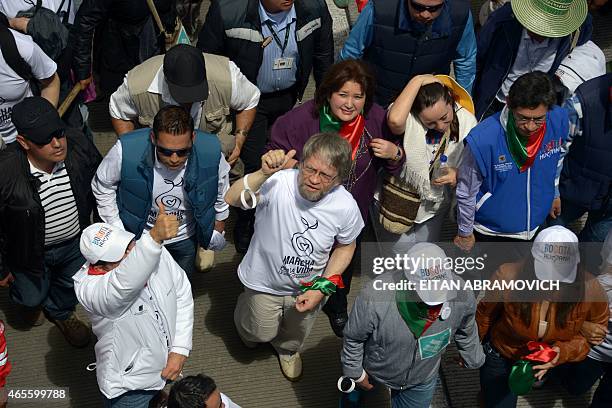 Bogota's former Mayor Antanas Mockus gives the thumb up during the "March For Life" in Bogota, Colombia, on March 8, 2015. Thousands of people took...