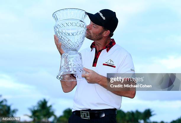 Alex Cejka of Germany celebrates with the trophy after winning the playoff during the final round of the Puerto Rico Open presented by Banco Popular...