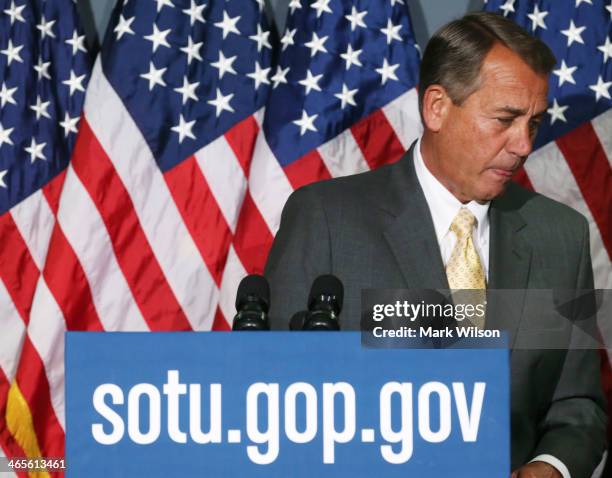 House Speaker John Boehner walks away after speaking to the media after attending the weekly House Republican conference at the U.S. Capitol January...