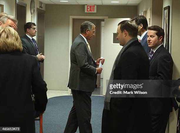 House Speaker John Boehner stands in a hallway before speaking to the media after attending the weekly House Republican conference at the U.S....