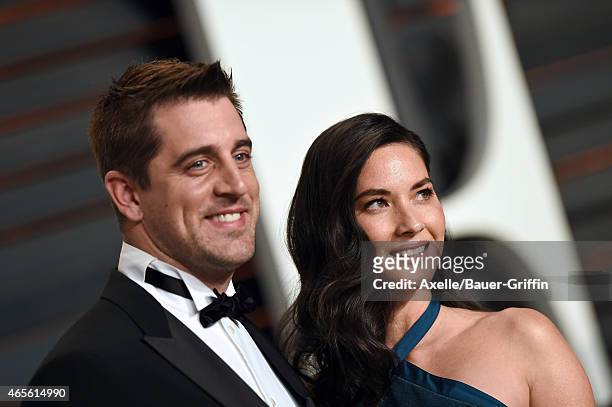 Professional football player Aaron Rodgers and actress Olivia Munn arrive at the 2015 Vanity Fair Oscar Party Hosted By Graydon Carter at Wallis...