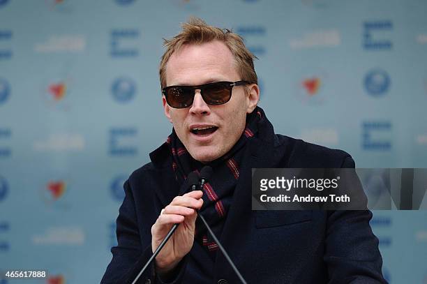 Actor Paul Bettany speaks on stage during the 2015 International Women's Day March at Dag Hammarskjöld Plaza on March 8, 2015 in New York City.