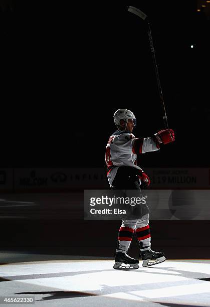 Adam Henrique of the New Jersey Devils salutes the fans after the game against the Philadelphia Flyers on March 8, 2015 at the Prudential Center in...