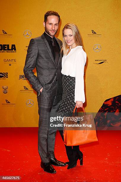 Lee Rychter and Leonie Jung attend the premiere of the film 'Mandela: Long Walk to Freedom' at Zoo Palast on January 28, 2014 in Berlin, Germany.