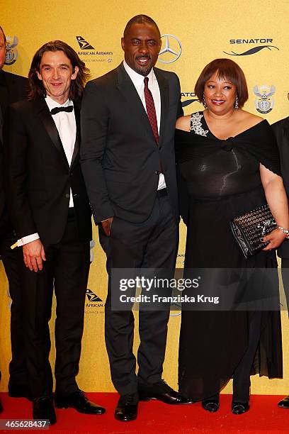 Justin Chadwick, Idris Elba and Zindzi Mandela attend the premiere of the film 'Mandela: Long Walk to Freedom' at Zoo Palast on January 28, 2014 in...