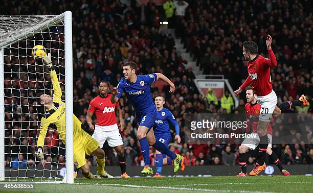 Robin van Persie of Manchester United scores their first goal during the Barclays Premier League match between Manchester United and Cardiff City at...