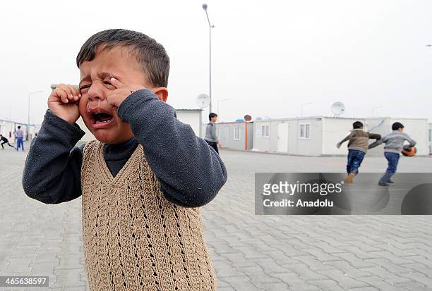 Syrians fled to Turkey due to the Syrian civil war are hosted in Nizip container city, official name of the refugee camp on January 28, 2014 in...