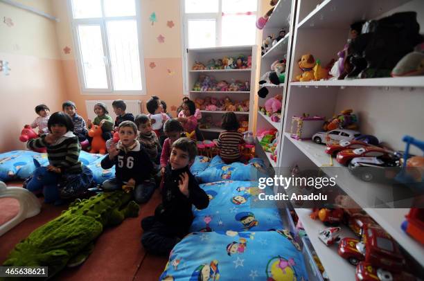 Syrians fled to Turkey due to the Syrian civil war are hosted in Nizip container city, official name of the refugee camp on January 28, 2014 in...