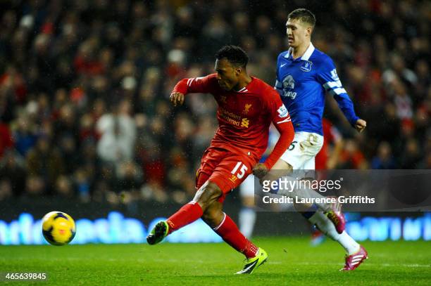 Daniel Sturridge of Liverpool scores his team's second goal during the Barclays Premier League match between Liverpool and Everton at Anfield on...