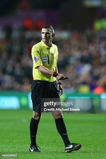Referee Michael OLiver during the Barclays Premier League match between Swansea City and Fulham at the Liberty Stadium on January 28, 2014 in...