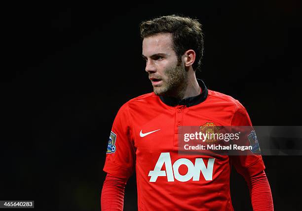 New signing Juan Mata of Manchester United looks on during the Barclays Premier League match between Manchester United and Cardiff City at Old...