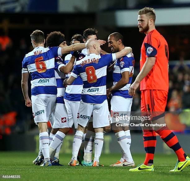 Karl Henry of QPR celebrates with team mates after scoring the second goal during the Sky Bet Championship match between Queens Park Rangers and...