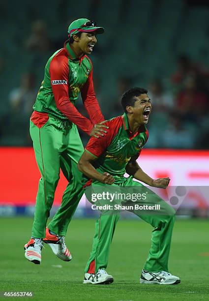 Taskin Ahmed of Bangladesh celebrates with team-mate Soumya Sarkar after taking the wicket of James Taylor of England during the 2015 ICC Cricket...