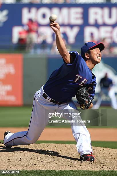 Kyuji Fujikawa of the Texas Rangers pitches during the spring training game between the Texas Rangers and Cleveland Indians at the Surprise Stadium...