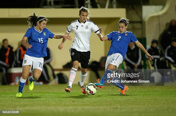 Anna Gasper of Germany and Valentina Bergamaschi and Lisa Boattin of Italy fight for the ball during the women's U19 international friendly match...