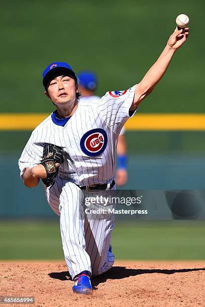 Tsuyoshi Wada of the Chicago Cubs pitches during the spring training game between the Chicago Cubs and Texas Rangers at the Sloan Park on March 8,...