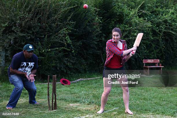 Racer Sarah Walker plays a shot during a backyard cricket match, captained by Kiwi cricket greats Sir Richard Hadlee and Stephen Fleming, - under the...