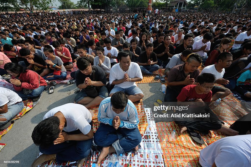 Thai devotees pray during the Tattoo Festival at Wat Bang...