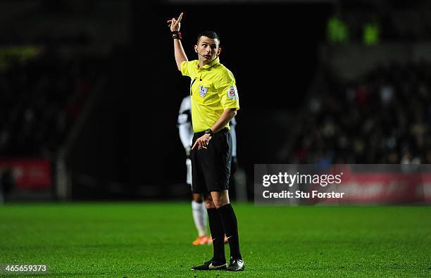 Referee Michael Oliver in action during the Barclays Premier League match between Swansea City and Fulham at Liberty Stadium on January 28, 2014 in...