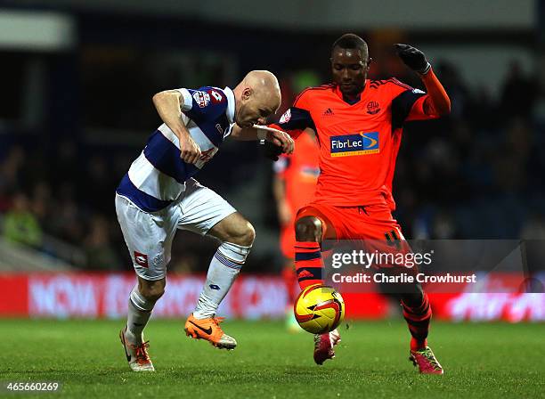 Andrew Johnson of QPR tries to hold off Mohamed Kamara of Bolton during the Sky Bet Championship match between Queens Park Rangers and Bolton...