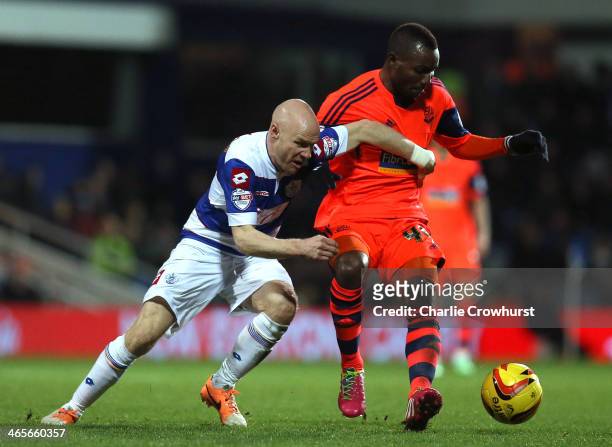 Andrew Johnson of QPR tries to hold off Mohamed Kamara of Bolton during the Sky Bet Championship match between Queens Park Rangers and Bolton...