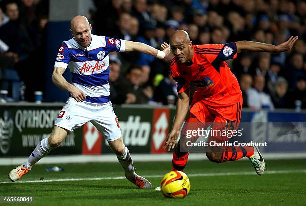 Andrew Johnson of QPR is pushed off the ball by Bolton's Alex Baptiste during the Sky Bet Championship match between Queens Park Rangers and Bolton...