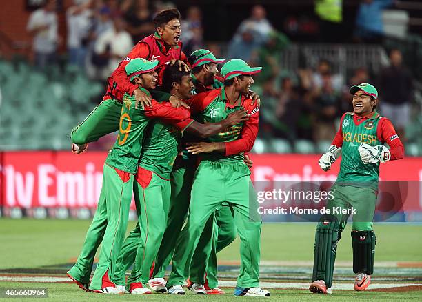 Bangladesh players celebrate after winning the 2015 ICC Cricket World Cup match between England and Bangladesh at Adelaide Oval on March 9, 2015 in...