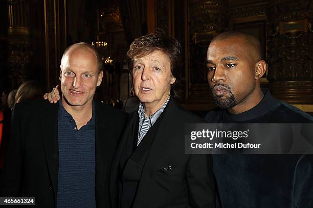 Woody Harrelson, Paul McCartney and Kanye West attend the Stella McCartney show as part of the Paris Fashion Week Womenswear Fall/Winter 2015/2016 at...