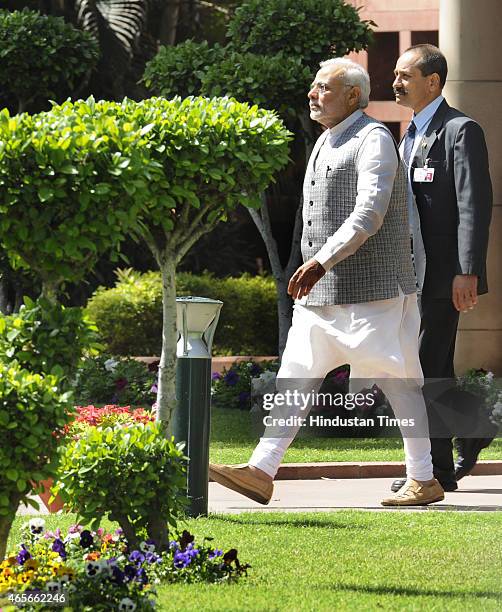 Prime Minister Narendra Modi coming out after meeting with West Bengal Chief Minister Mamta Banerjee at Parliament on March 9, 2015 in New Delhi,...