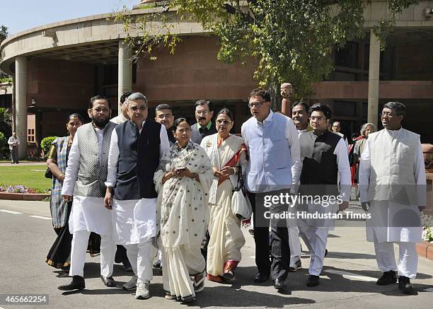 West Bengal Chief Minister Mamta Banerjee with her party MPs coming out after meeting with Prime Minister Narendra Modi at Parliament on March 9,...