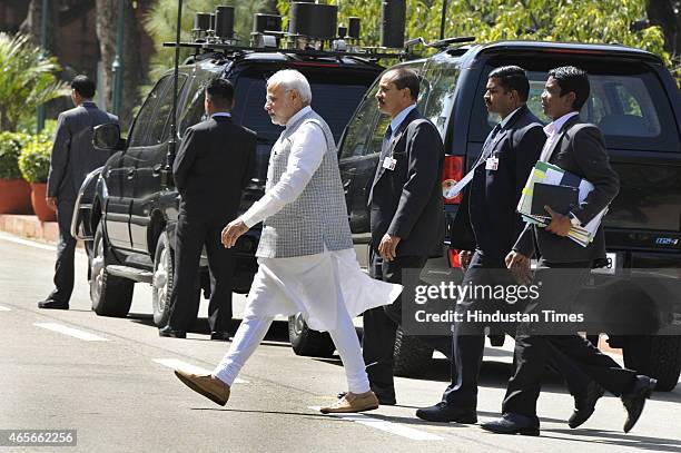 Prime Minister Narendra Modi coming out after meeting with West Bengal Chief Minister Mamta Banerjee at Parliament on March 9, 2015 in New Delhi,...