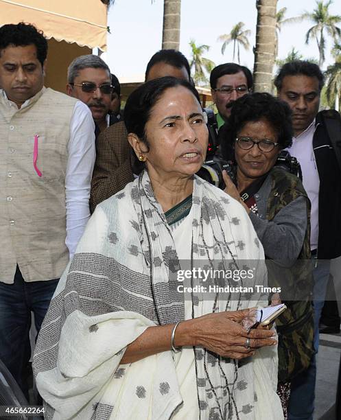 West Bengal Chief Minister Mamta Banerjee with her party MPs coming out after meeting with Prime Minister Narendra Modi at Parliament on March 9,...