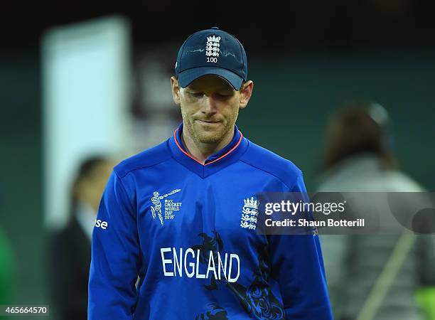 England captain Eoin Morgan looks dejected as he leaves the field after the 2015 ICC Cricket World Cup match between England and Bangladesh at...