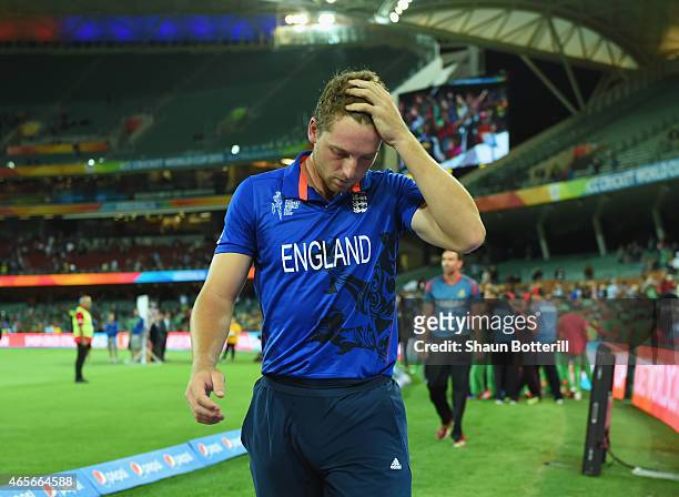 England vice captain Jos Buttler looks dejected as he leaves the field after the 2015 ICC Cricket World Cup match between England and Bangladesh at...