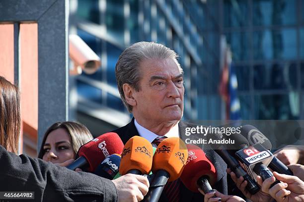 Former Albanian Prime Minister Sali Berisha speaks to the media outside the prosecution office after he testified on an assassination attempt on...