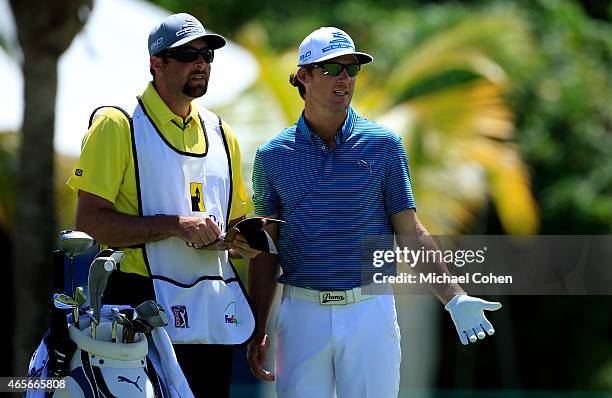 Will MacKenzie and his caddie prepare to hit from the third tee during the final round of the Puerto Rico Open presented by Banco Popular on March 8,...