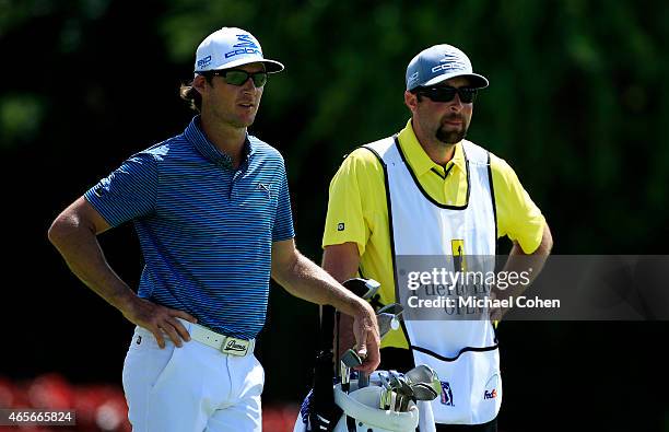 Will MacKenzie and his caddie prepare to hit from the third tee during the final round of the Puerto Rico Open presented by Banco Popular on March 8,...