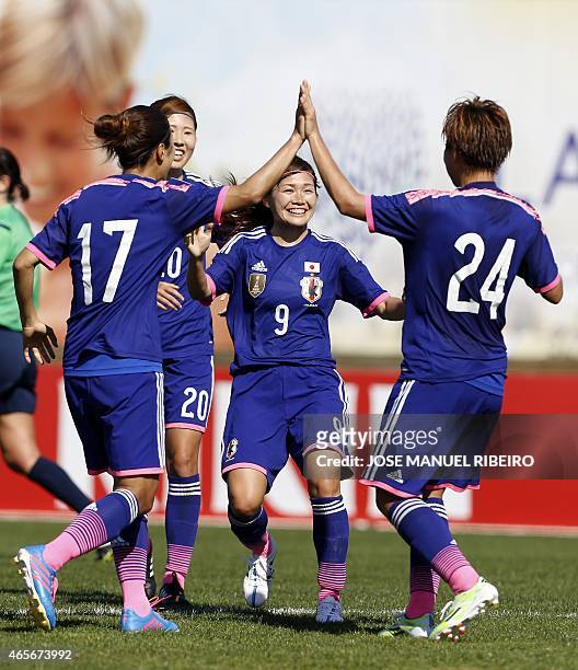 Japan's midfielder Nahomi Kawasumi celebrates her goal with mates forward Yuki Ogimi , defender Yuri Kawamura and forward Yuika Sugasawa during the...