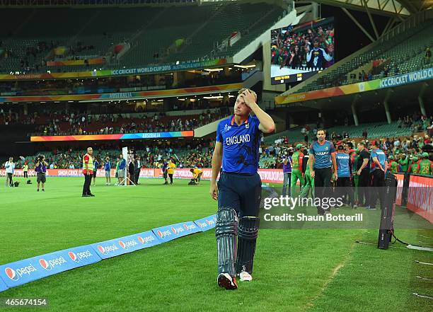 England vice captain Jos Buttler looks dejected as he leaves the field after the 2015 ICC Cricket World Cup match between England and Bangladesh at...