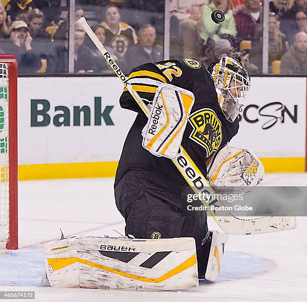 Boston Bruins goalie Niklas Svedberg using his head to deflect the puck against the Detroit Red Wings during third period action at the TD Garden on...